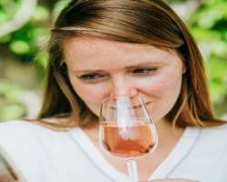 Olivia Newton-John consuming alcohol